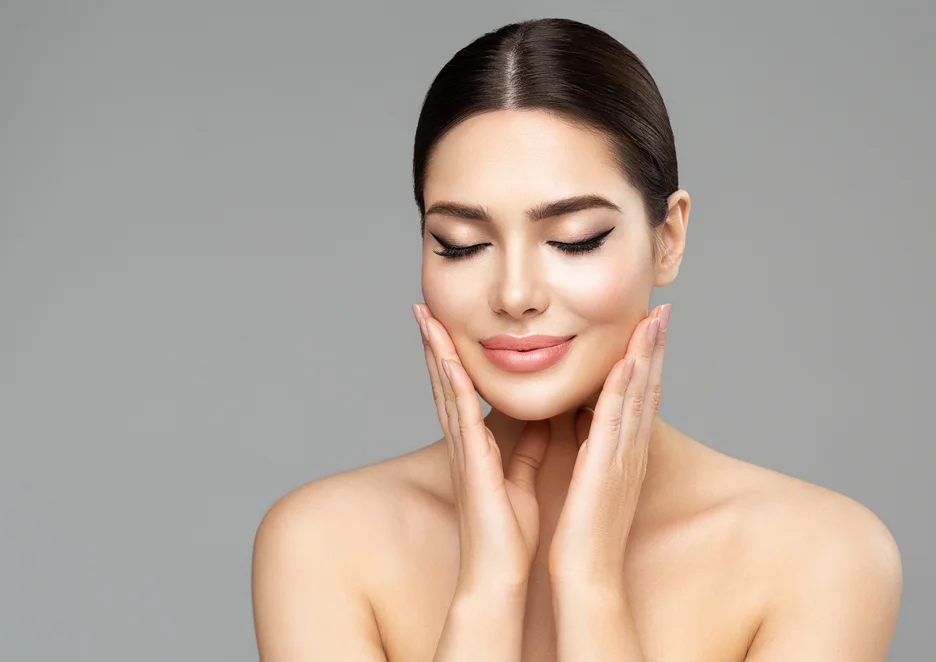 a portrait of a woman touching her face